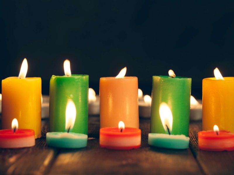 candles-glowing-in-the-darkness-on-wood-surface-2026-09-23-18-11-56-utc